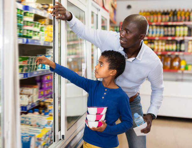 istock Nice African American father and son in store 1152769215