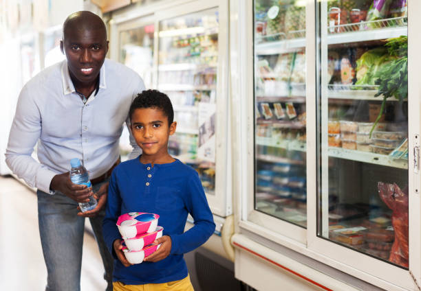 istock African father and son in store 1152769219
