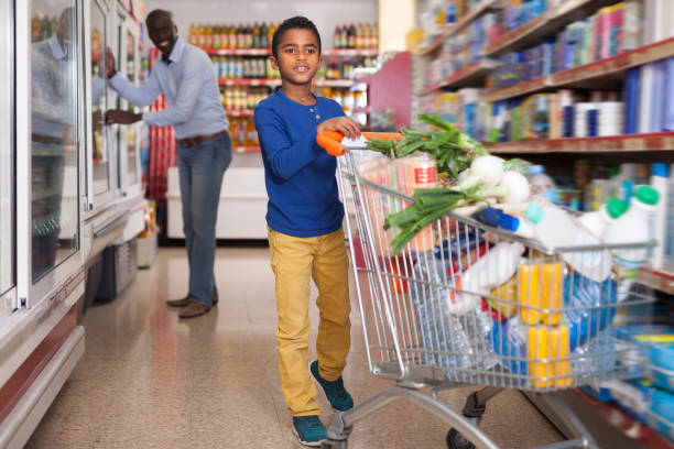 istock Nice African American boy carrying purchases 1152769243
