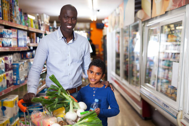 istock African father and son in store 1152769245