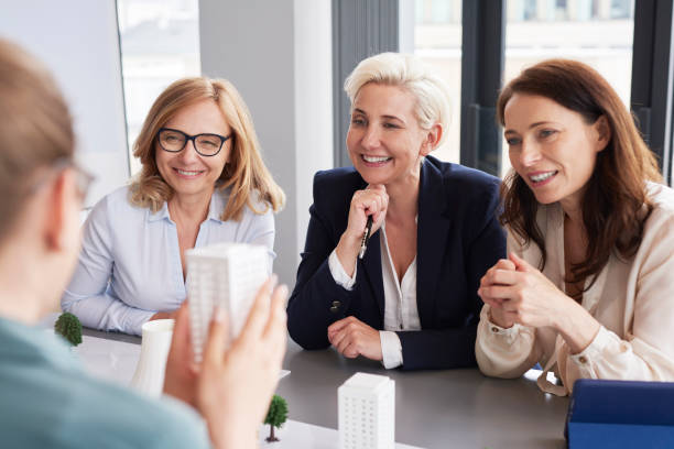 istock Three mature businesswomen having a conversation at conference table 1152769948