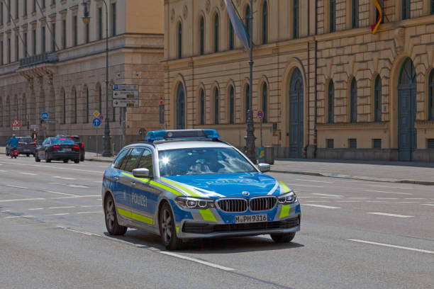 Munich, Germany - May 30 2019: Police car patroling the street opposite Hofgarten.