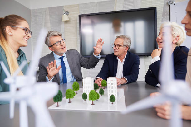 istock Senior businessman leading during conference 1152770242