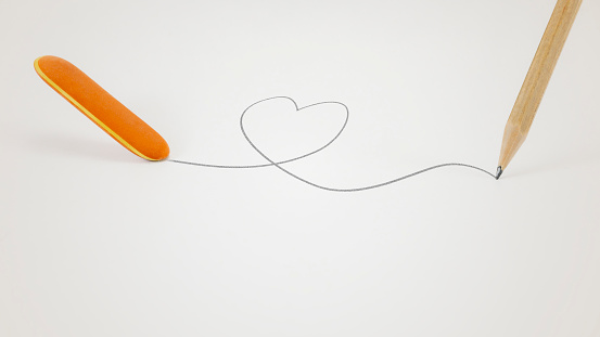 A rubber deletes a heart drawn by a pencil.