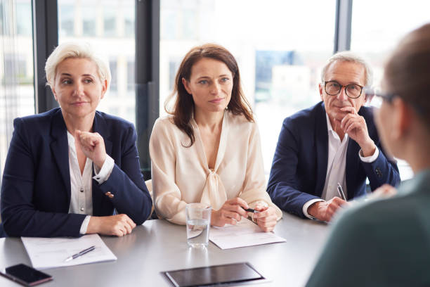 istock Business people having a conversation at conference table 1152772973