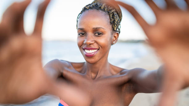 istock Portrait of Afro woman using hands to make a frame 1152772989