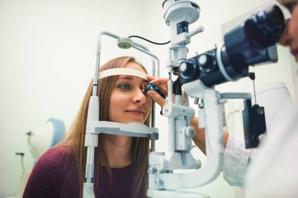 Eyesight exam Ophthalmology eyesight examination dilation stock pictures, royalty-free photos & images
