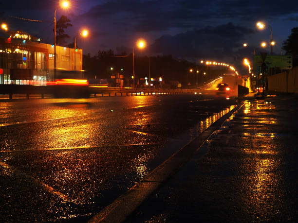 istock Driving on the night road 1152773275