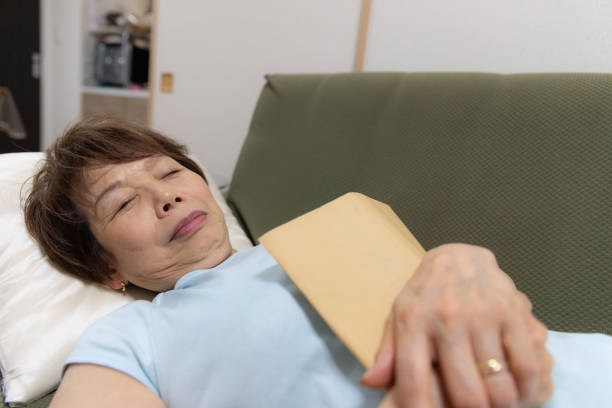 istock Senior woman lying on sofa 1152774758