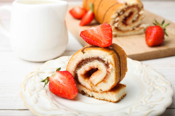 istock roll with strawberries on plate and milk jug 1152774880