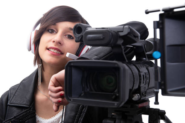 istock young woman with professional video camera, isolated on white background 1152775547