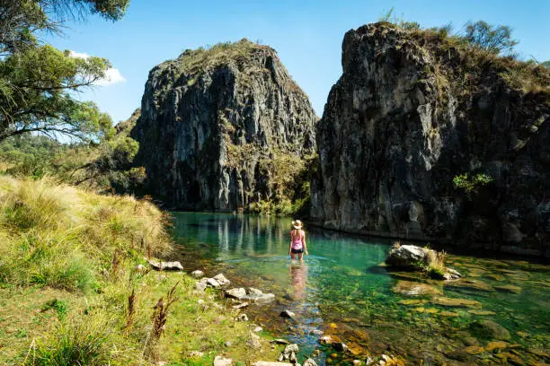 Photo of Woman wading in  one of the spectacular gorges of Snowy Mountains Australia