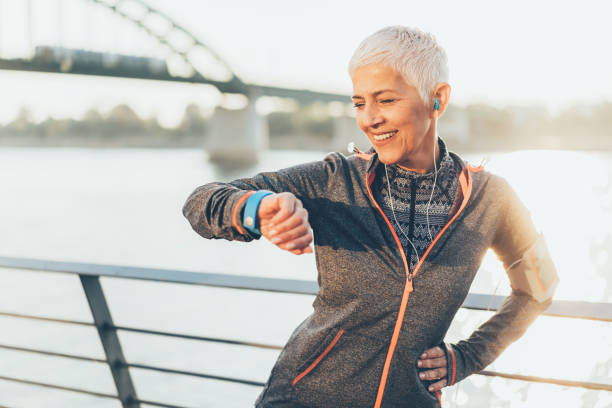 istock Athletic senior woman using smart watch 1152777114