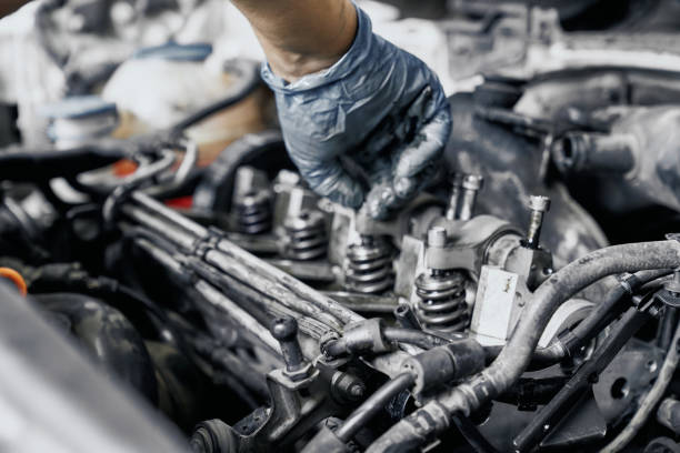 Close Up Of Nozzles In Car Diesel Engine With Mechanics Hand In Blue Dirty  Rubber Gloves Doing Professional Auto Repairing Engine Maintenance Concept  Stock Photo - Download Image Now - iStock