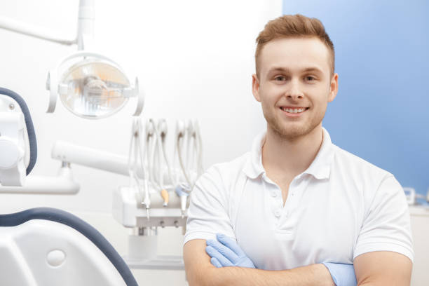 istock Cheerful male dentist working at his clinic 1152780107