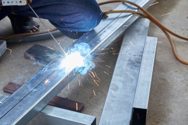 istock Asian worker making sparks while welding steel 1152781127