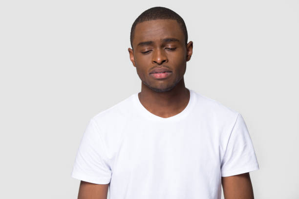 istock Head shot sad african male studio portrait on grey background 1152782335