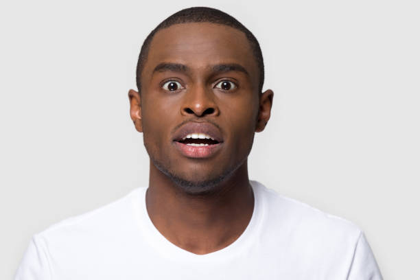 istock Portrait african man makes big eyes feels amazed studio shot 1152782367
