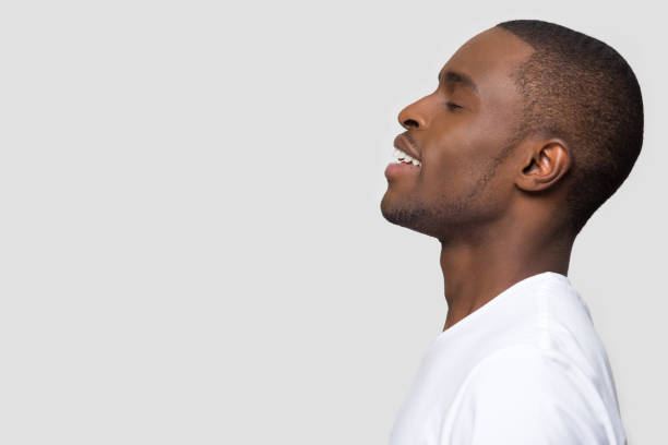 istock Side profile african man face closed eyes enjoy fresh air 1152782373