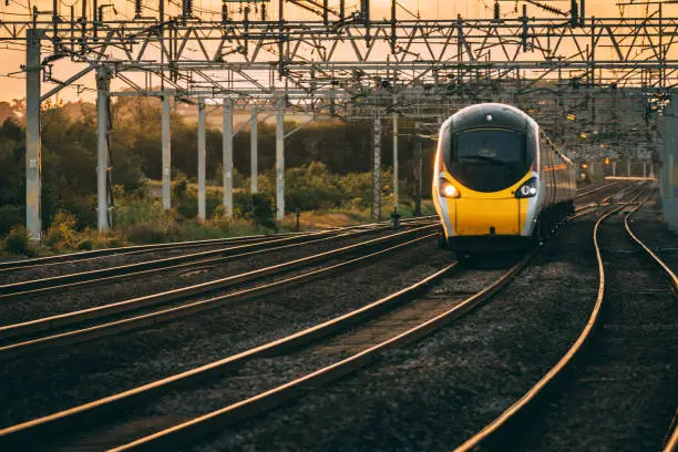 Pendolino passes as the sun set in the background