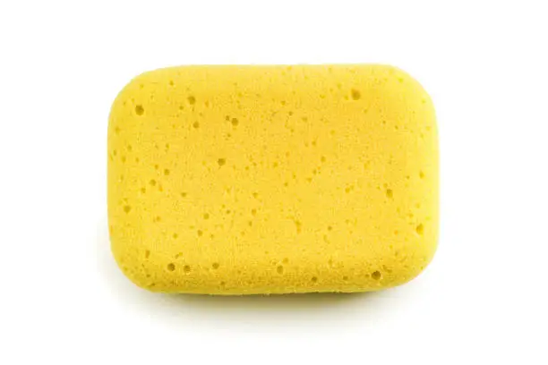 Yellow sponge isolated on the white background. Top view