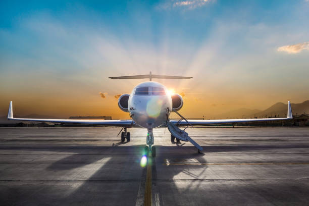 Business Jet on Ramp with Sun in Background