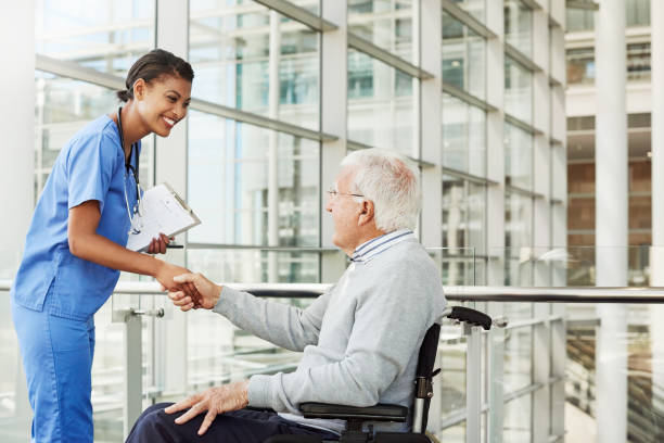 thank you for seeing me - doctor patient greeting talking imagens e fotografias de stock