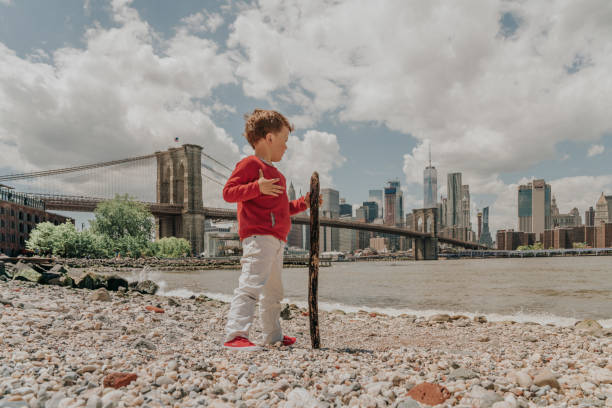 istock Boy playing in the Brooklyn Bridge Park, New York 1152787503