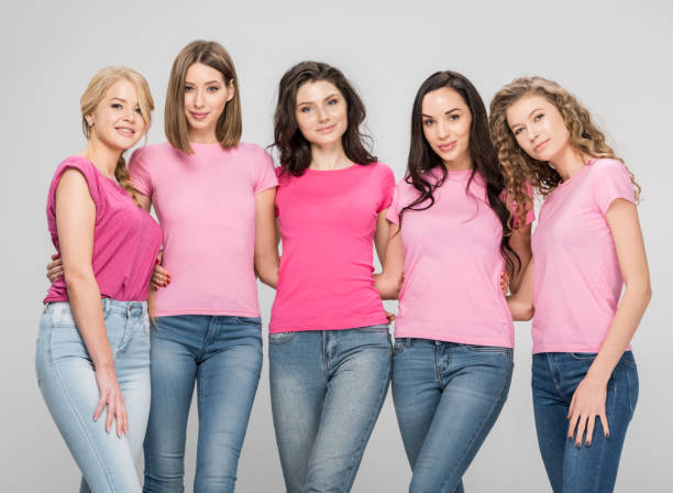 istock attractive women standing together isolated on grey 1152790524