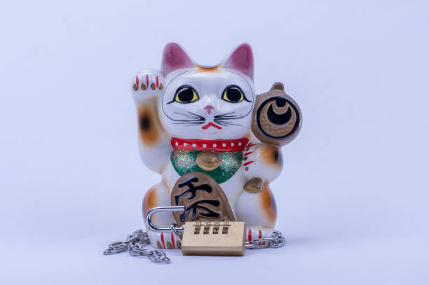 istock The beckoning cat which protects money with a chain. 1152792210