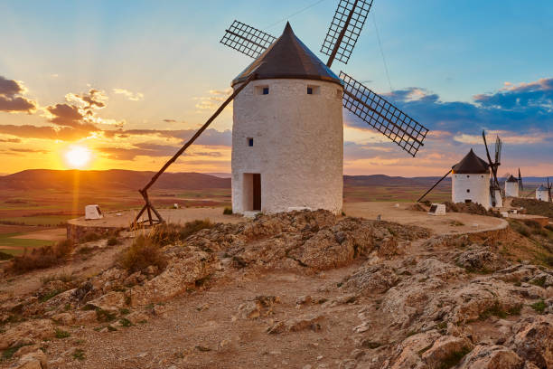 istock Traditional antique windmills at sunset in Spain. Consuegra, Toledo 1152797242