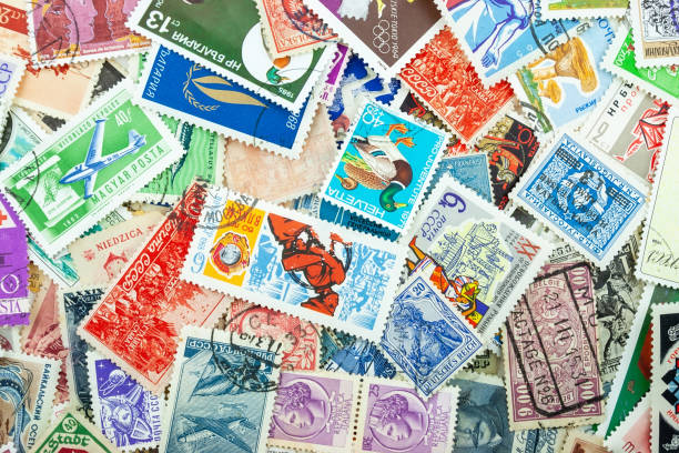 istock Background from a variety of multi-colored postage stamps from different countries and years 1152797334