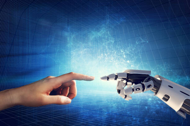istock Human and robotic hand touching fingers. 1152797371