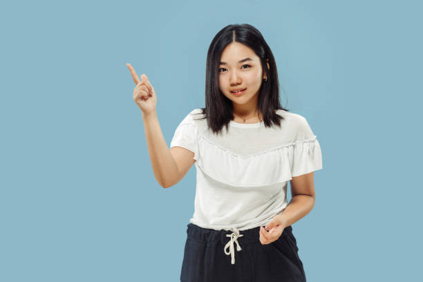 istock Korean young woman's half-length portrait on blue background 1152801714