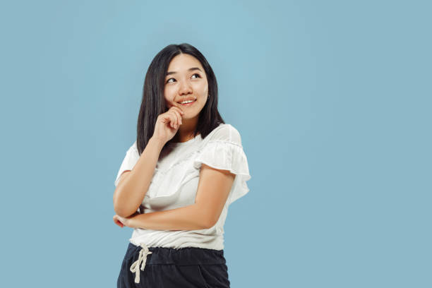 istock Korean young woman's half-length portrait on blue background 1152801737