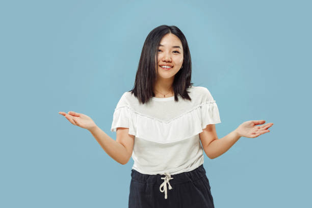 istock Korean young woman's half-length portrait on blue background 1152801739