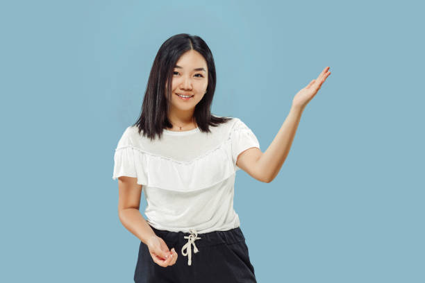 istock Korean young woman's half-length portrait on blue background 1152801741