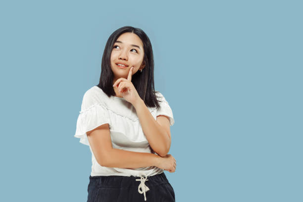 istock Korean young woman's half-length portrait on blue background 1152801742