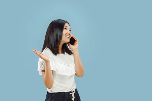 istock Korean young woman's half-length portrait on blue background 1152801763