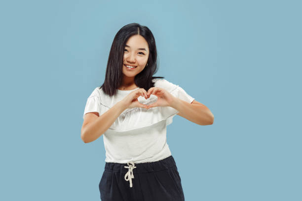 istock Korean young woman's half-length portrait on blue background 1152801799