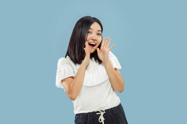 istock Korean young woman's half-length portrait on blue background 1152801870