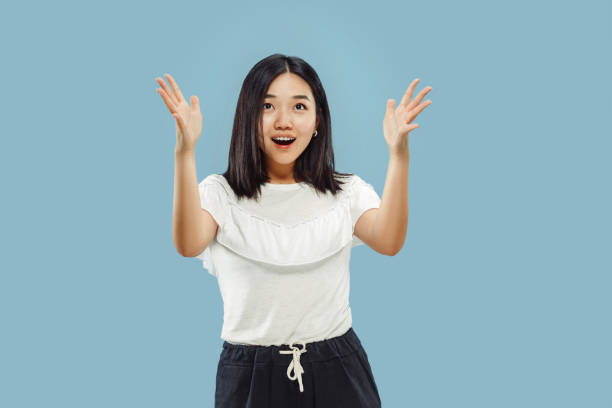 istock Korean young woman's half-length portrait on blue background 1152801898