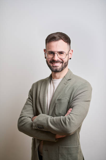 istock Business headshot, portrait looking at camera on gray background. 1152805722