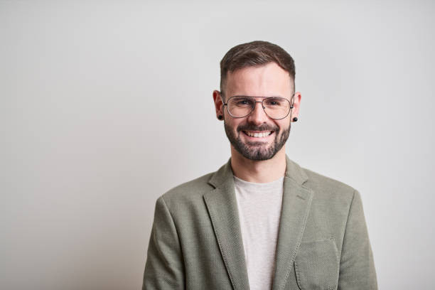istock Business headshot, portrait looking at camera on gray background. 1152805724