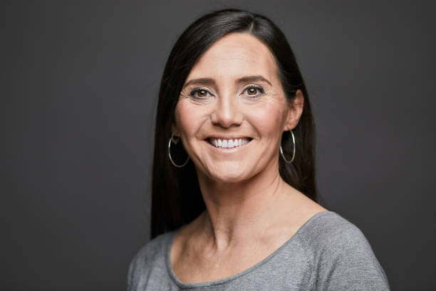 istock Business headshot, portrait looking at camera on gray background. 1152805725