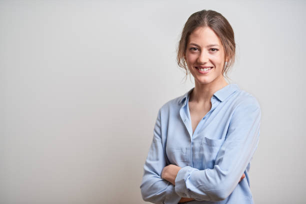 istock Business headshot, portrait looking at camera on gray background. 1152805729