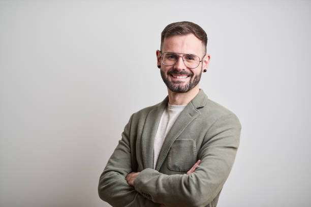 istock Business headshot, portrait looking at camera on gray background. 1152805731