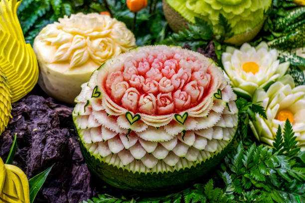 Thai Fruit carving Watermelon and cantaloupe Carving Thai Fruit carving Watermelon and cantaloupe Carving fruit carving stock pictures, royalty-free photos & images