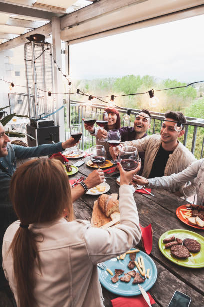 istock Happy group of friends drinking red wine 1152808474