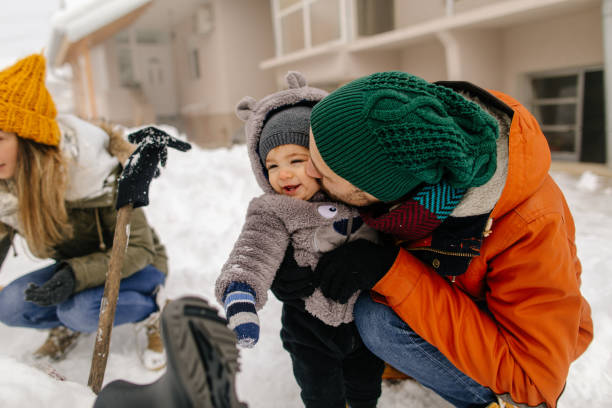 istock Family making a Snowman 1152808587